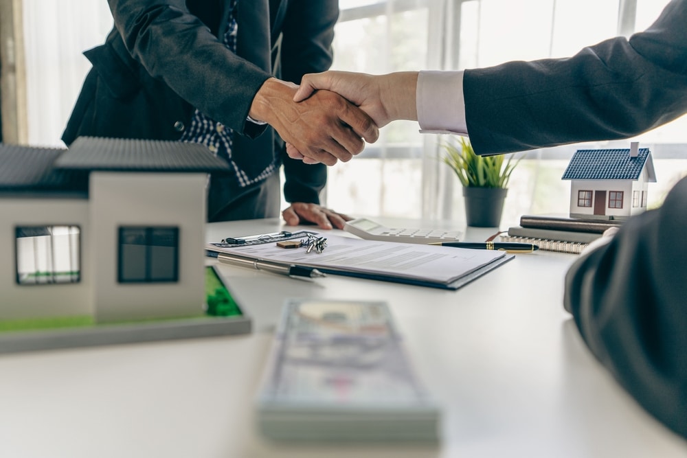 A,Real,Estate,Agent,Shakes,Hands,With,A,Client,After