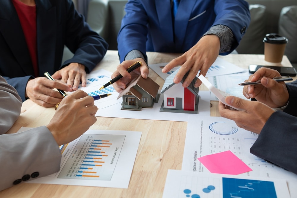 Real,Estate,Sales,Documents,And,Model,Homes,Are,Placed,On
