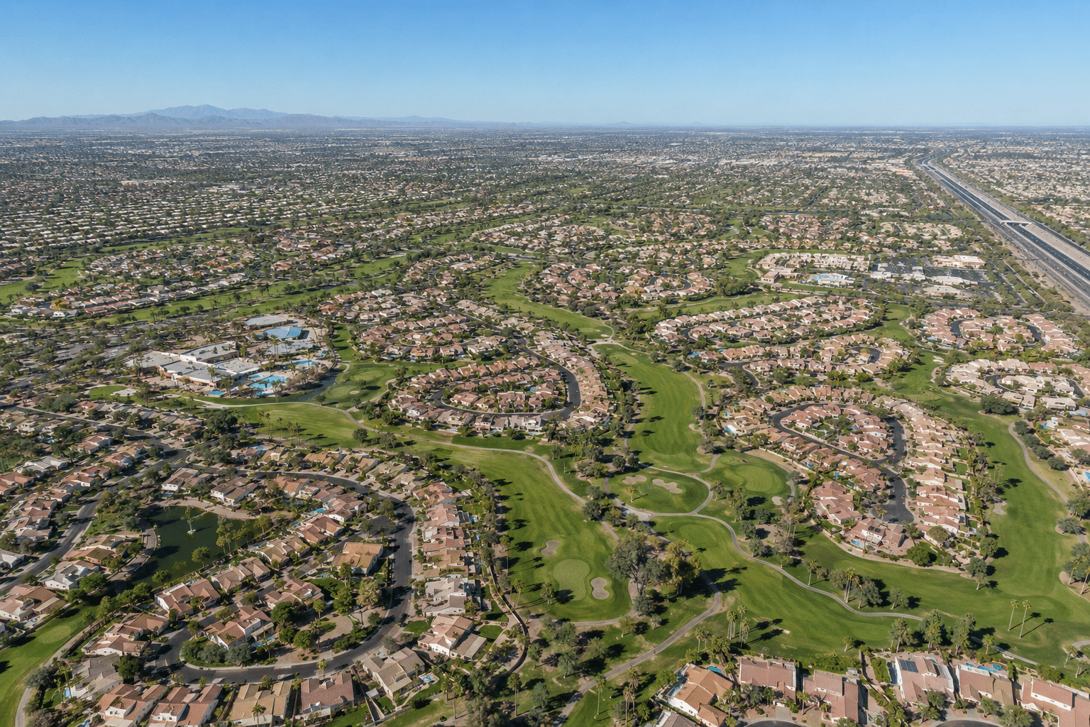 high-altitude aerial drone view of Westbrook Village in north Peoria, Arizona