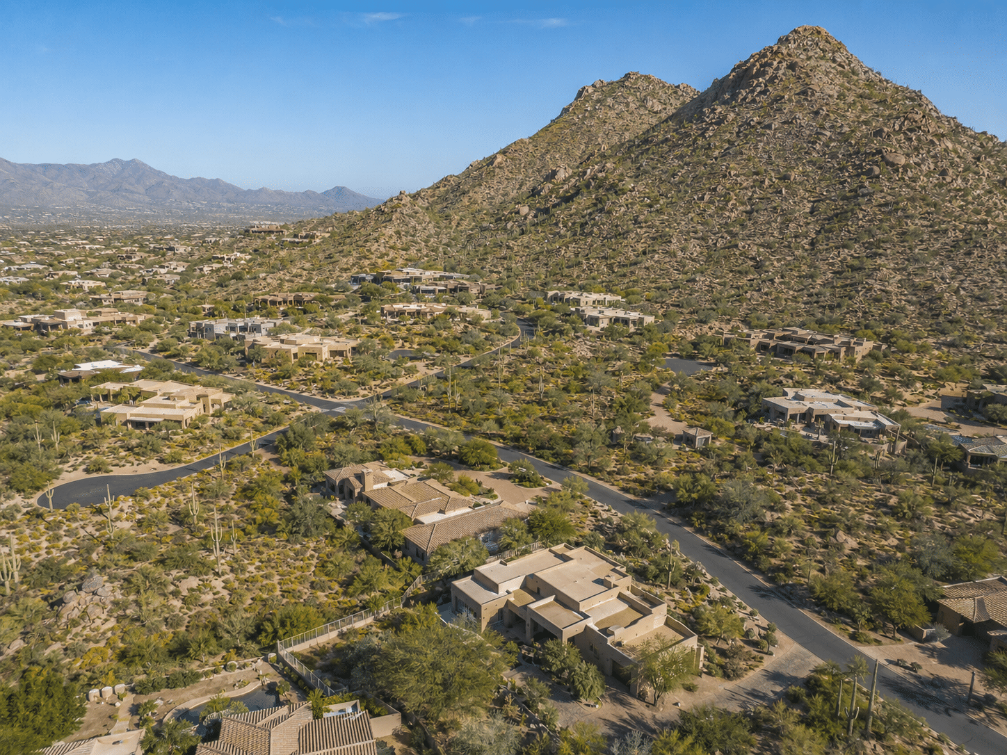 Troon Village master-planned community aerial view with Troon Mountain backdrop