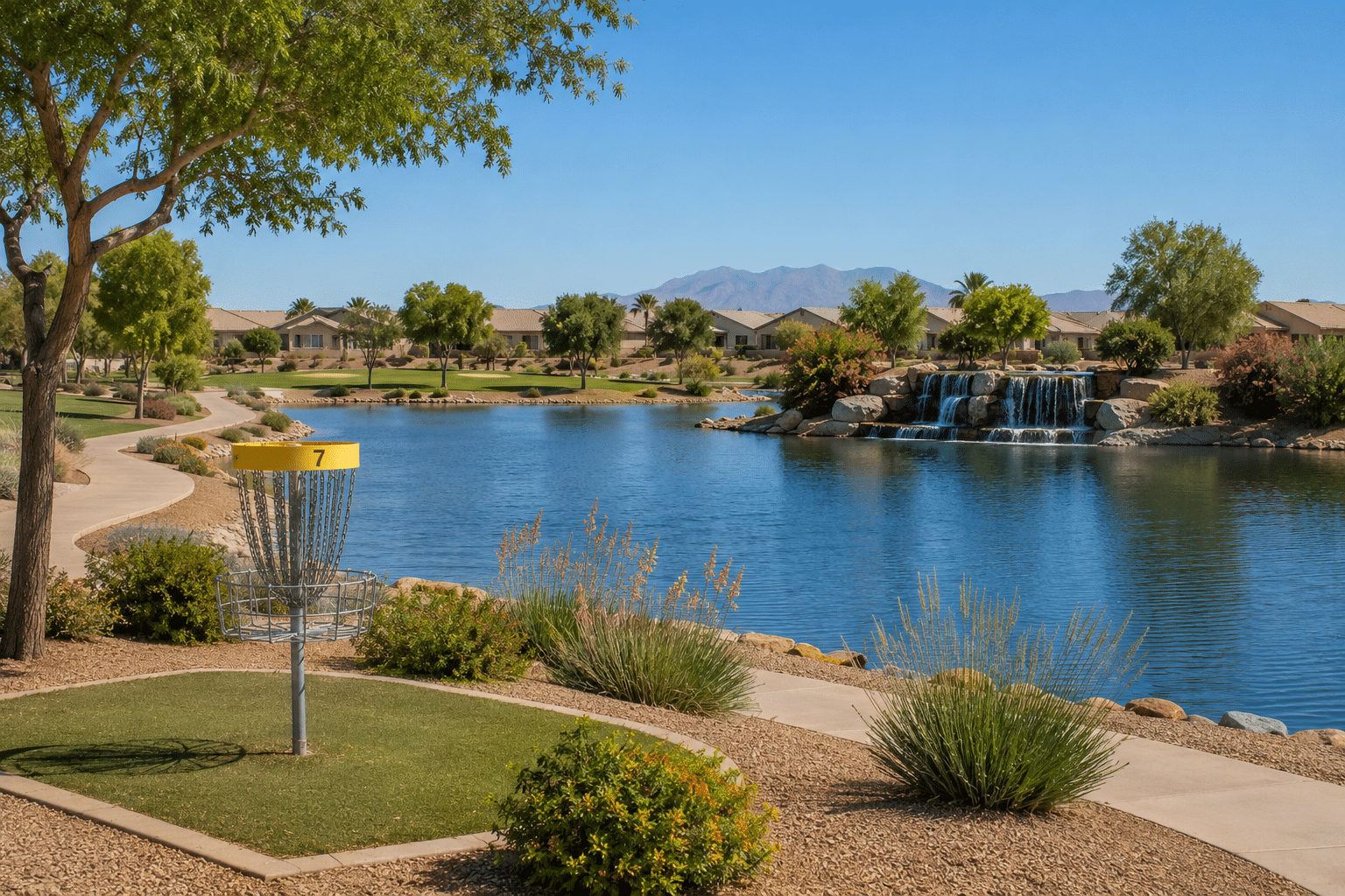 Maricopa Meadows community lake with disc golf course and waterfall Maricopa AZ